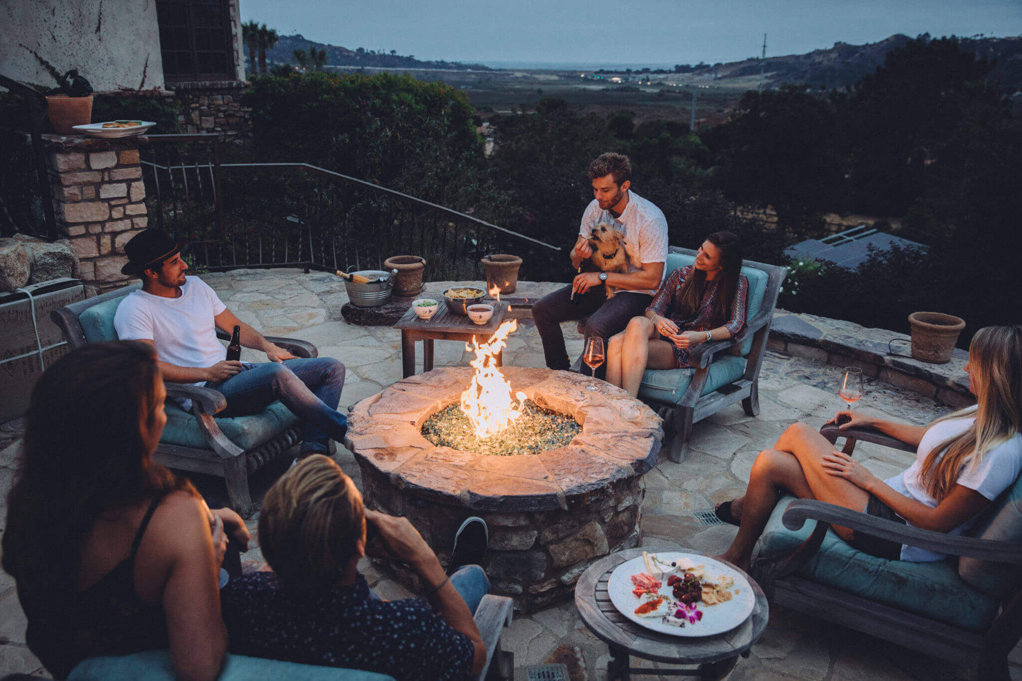 group of friends by fire pit