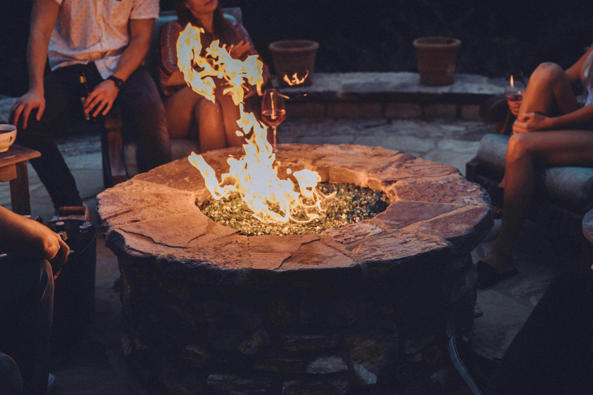 couple enjoying evening by fire pit